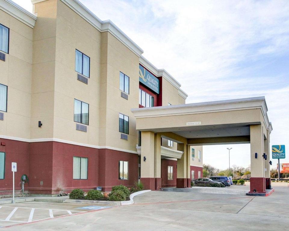 a rendering of a hotel with a parking lot at Quality Inn & Suites in Bryan