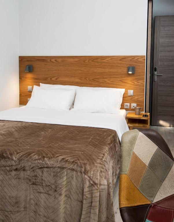 Posteľ alebo postele v izbe v ubytovaní DownTown Hotel