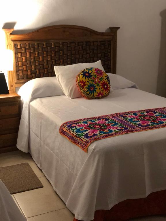 Postel nebo postele na pokoji v ubytování Hotel Real Colonial
