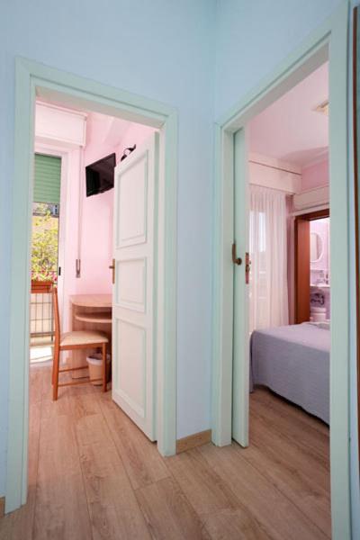 Postel nebo postele na pokoji v ubytování Hotel Vallechiara