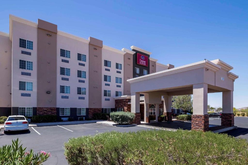 a hotel with a car parked in a parking lot at Comfort Suites El Paso Airport in El Paso