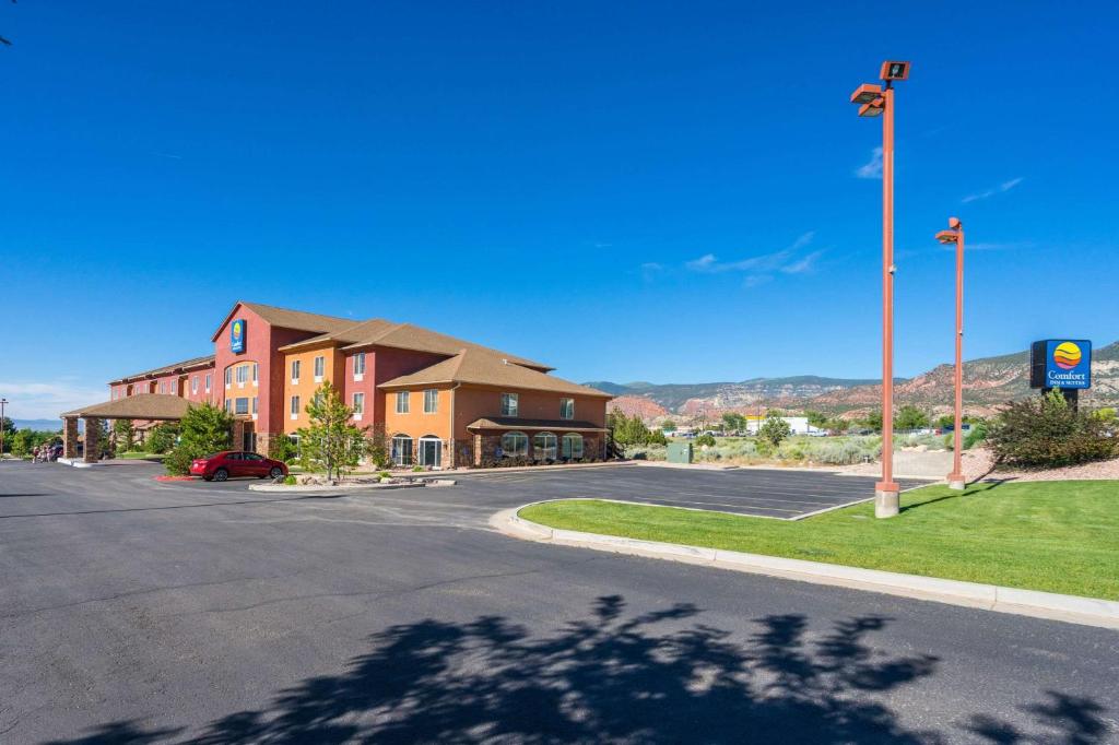 an empty parking lot in front of a building at Comfort Inn & Suites in Cedar City