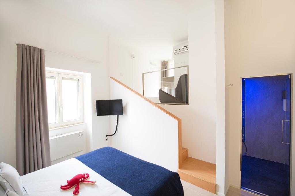 TV a/nebo společenská místnost v ubytování Al Castello Relais