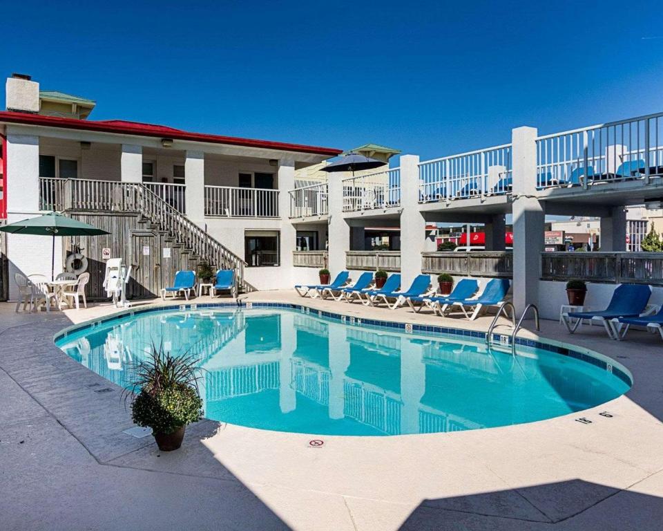 a swimming pool in front of a hotel at Hotel Ocean27 Oceanfront in Virginia Beach