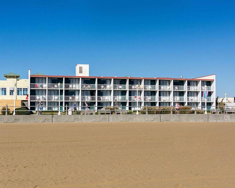 a hotel on the beach next to a sandy beach at Ocean27 Hotel in Virginia Beach