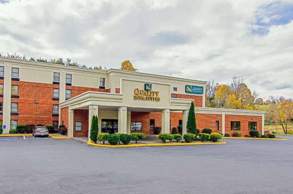 a building with a sign that reads quality pharmacy at Quality Inn & Suites Lexington near I-64 and I-81 in Timber Ridge