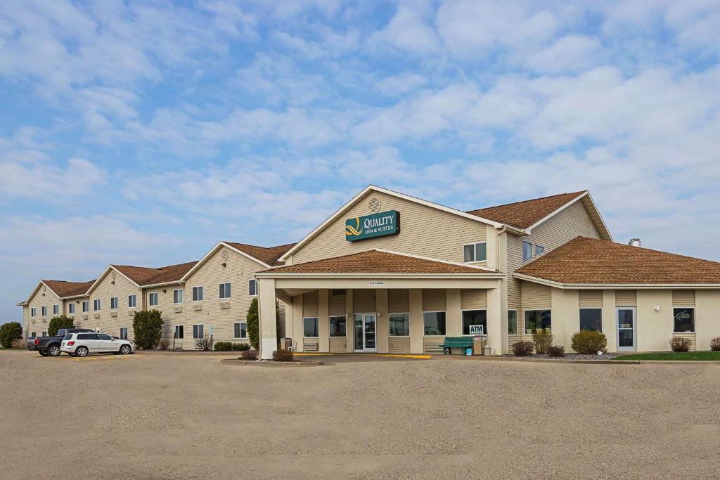 a inn with a car parked in a parking lot at Quality Inn & Suites Belmont Route 151 in Belmont