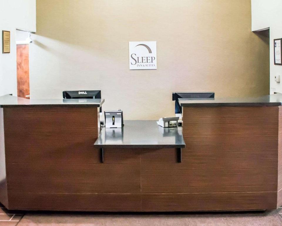 a waiting area at a nail salon with two desks at Sleep Inn in Summersville