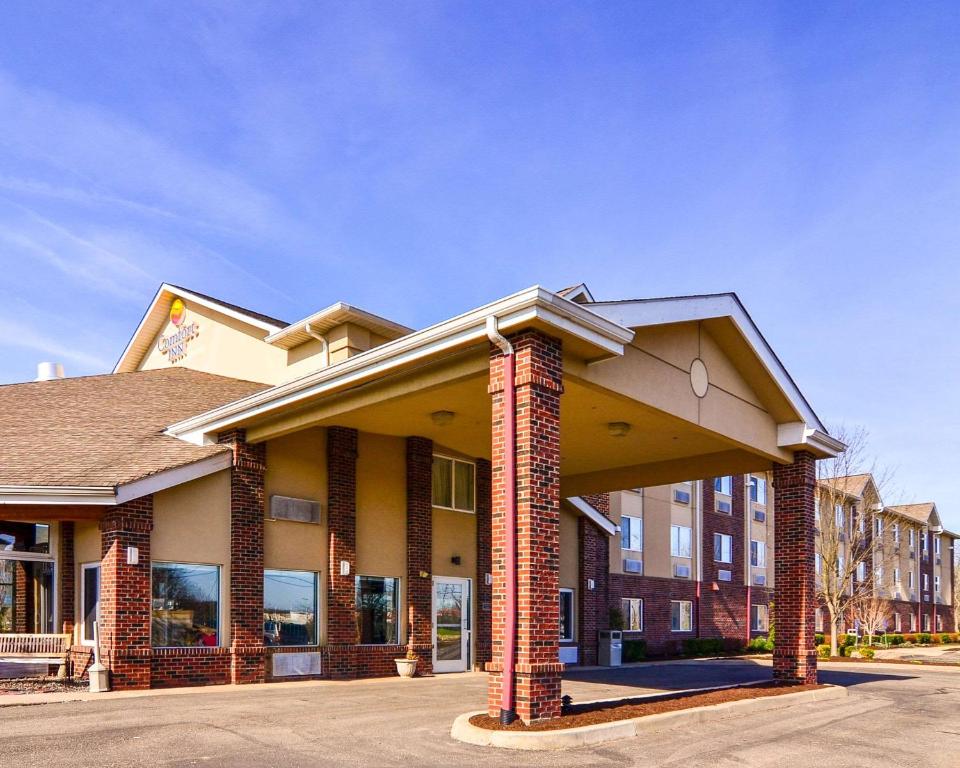 a hotel with a building with a brick at Comfort Inn Weirton in Weirton