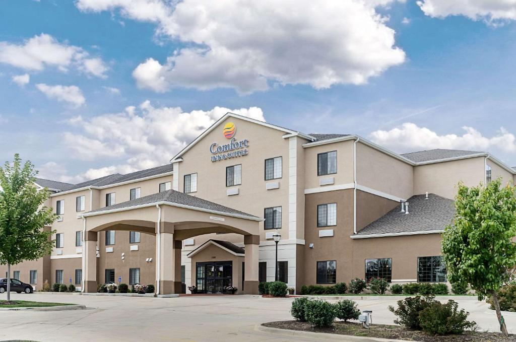 a large building with a clock on the front of it at Comfort Inn & Suites Lawrence in Lawrence