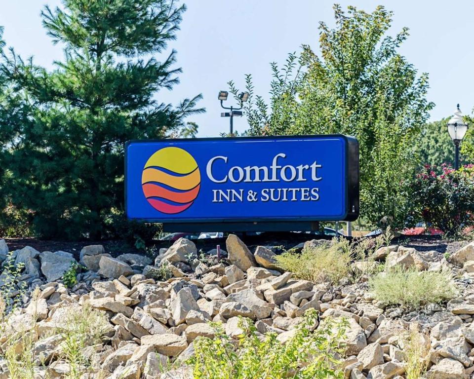 a sign for a comfort inn and suites at Comfort Inn & Suites Lawrence - University Area in Lawrence