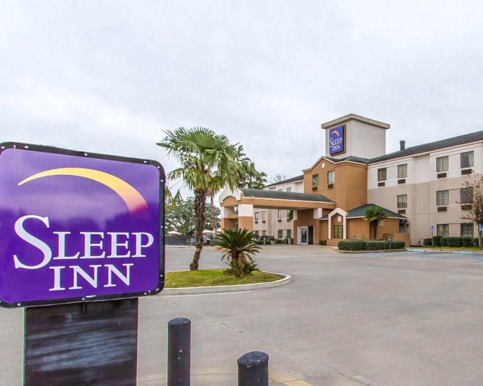 a sign in front of a hotel with a sleep inn at Sleep Inn Scott-Lafayette West in Scott