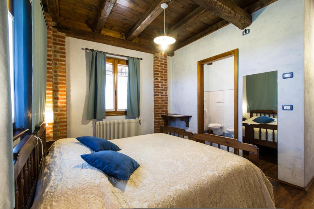 Postel nebo postele na pokoji v ubytování Agriturismo Borg da Ocjs