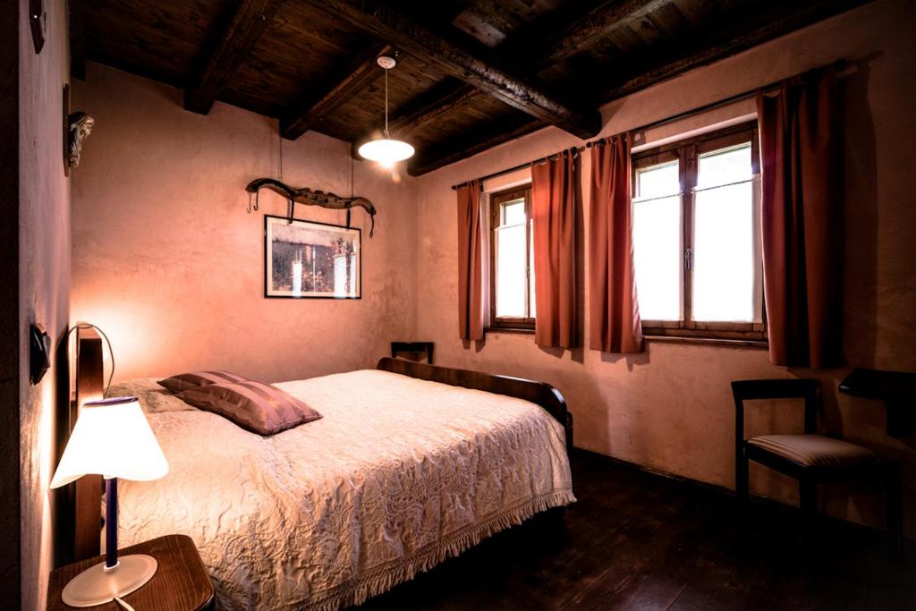 Postel nebo postele na pokoji v ubytování Agriturismo Borg da Ocjs