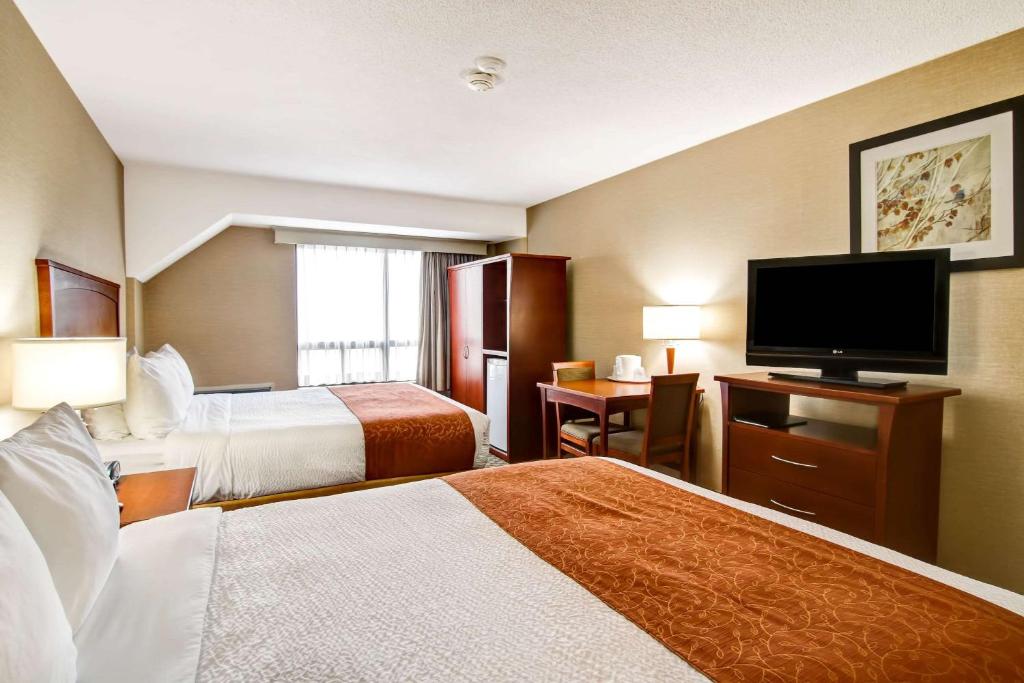 Postel nebo postele na pokoji v ubytování Quality Inn