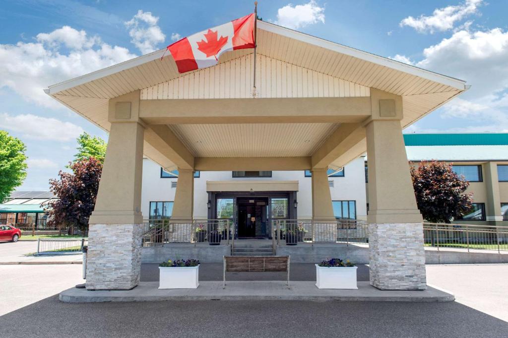 a pavilion with a canadian flag in front of a building at Clarion Hotel & Conference Centre in Pembroke
