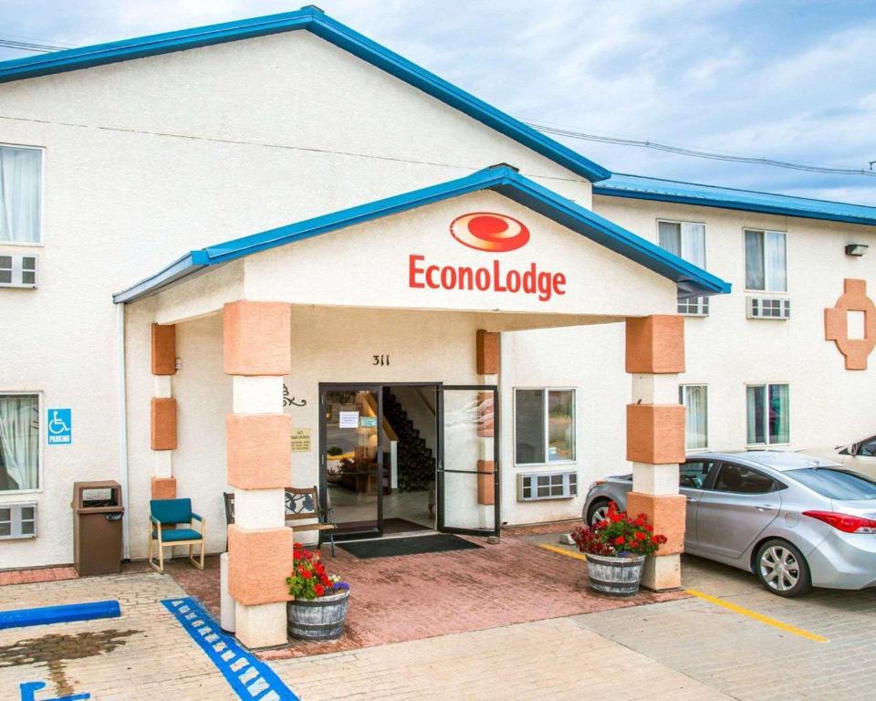 a rendering of the front of a hotel with a car parked outside at Econo Lodge in Canon City