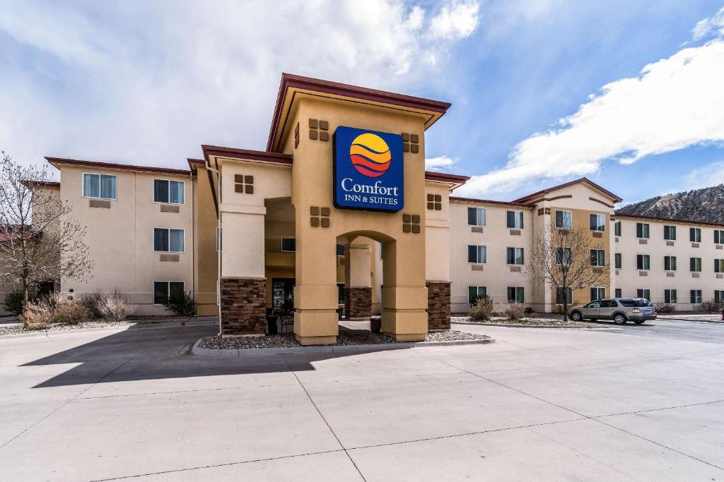 a building with a sign on the front of it at Comfort Inn and Suites Rifle in Rifle