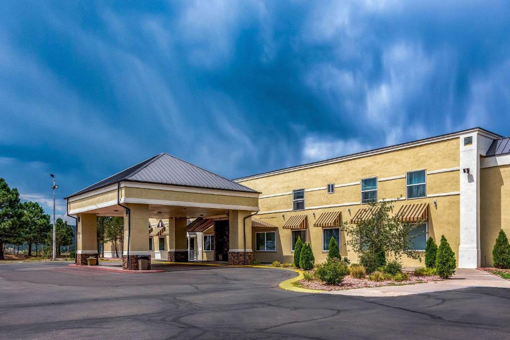 a large office building with a parking lot at Quality Inn Trinidad in Trinidad