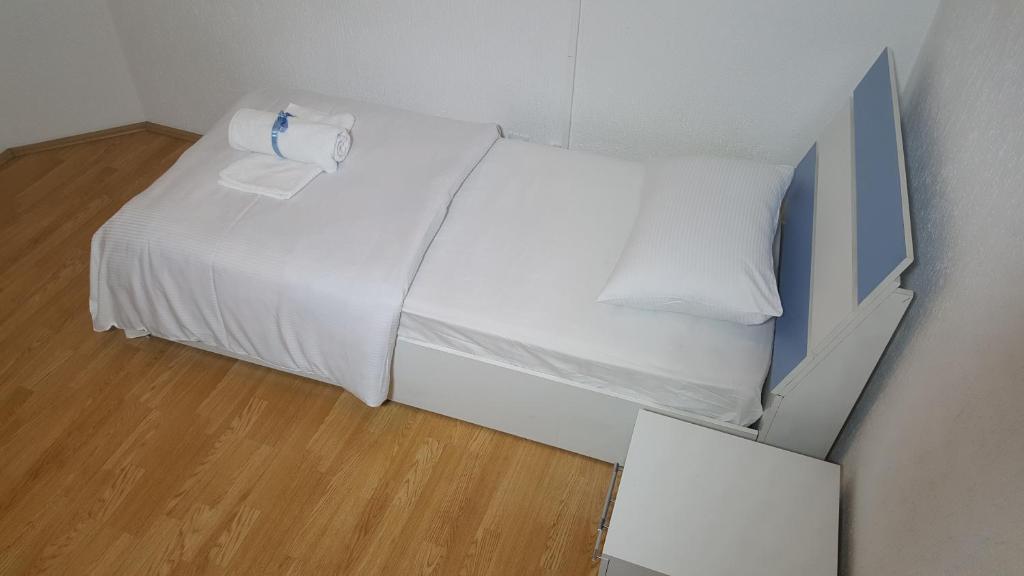 Postel nebo postele na pokoji v ubytování Bus Station Hostel