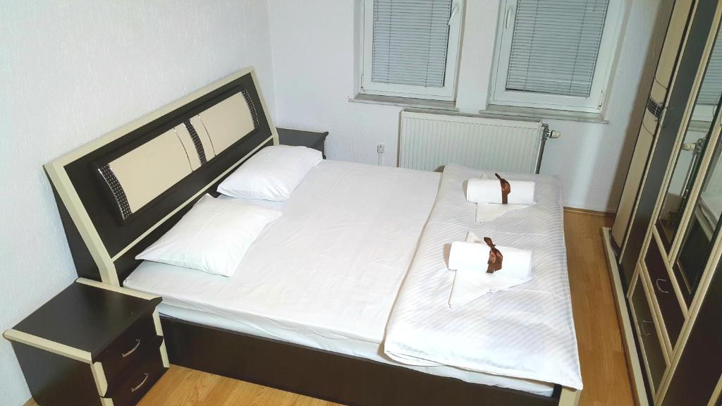 Postel nebo postele na pokoji v ubytování Bus Station Hostel