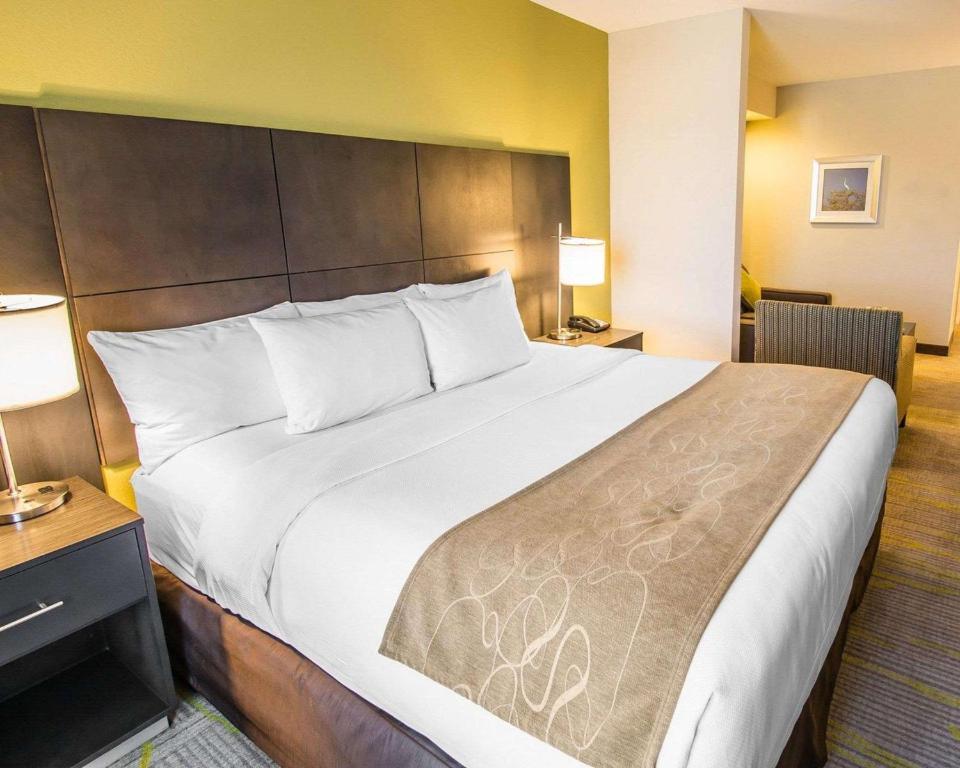a large bed in a hotel room at Comfort Suites Miami Airport North in Miami
