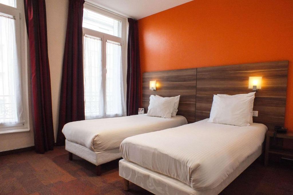 Postel nebo postele na pokoji v ubytování Hotel Cecil Metz Gare