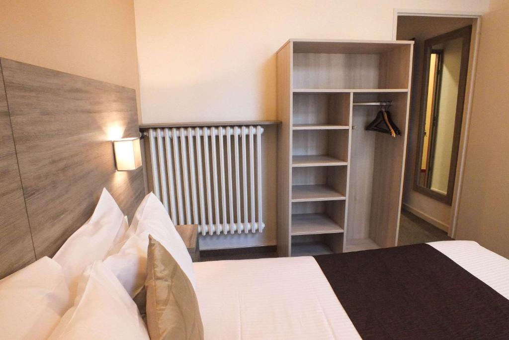 Postel nebo postele na pokoji v ubytování Hotel Cecil Metz Gare
