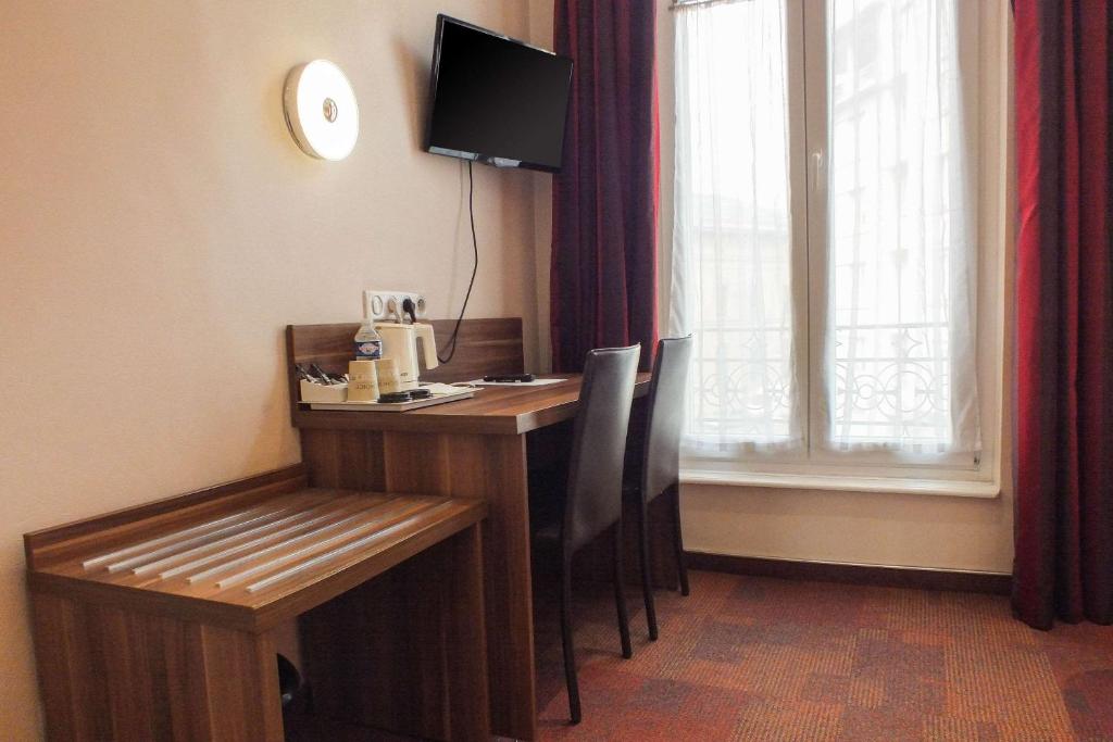 TV a/nebo společenská místnost v ubytování Hotel Cecil Metz Gare