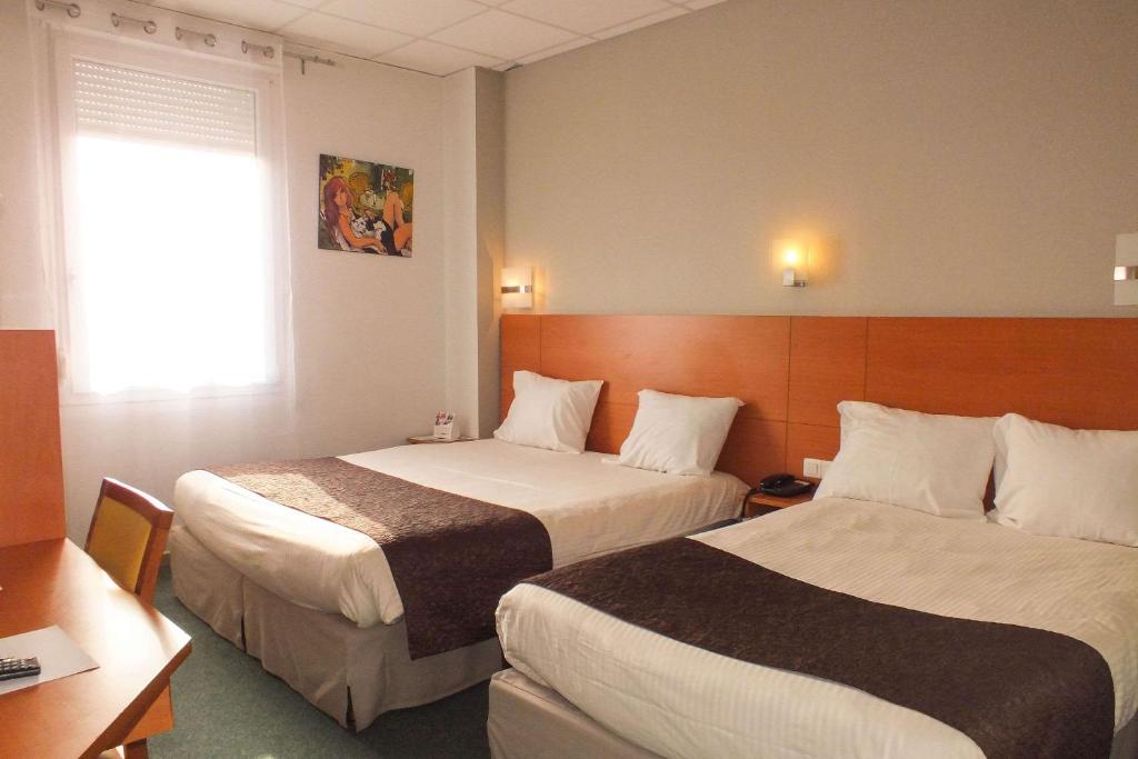 Postel nebo postele na pokoji v ubytování Hotel Cecil Metz Gare