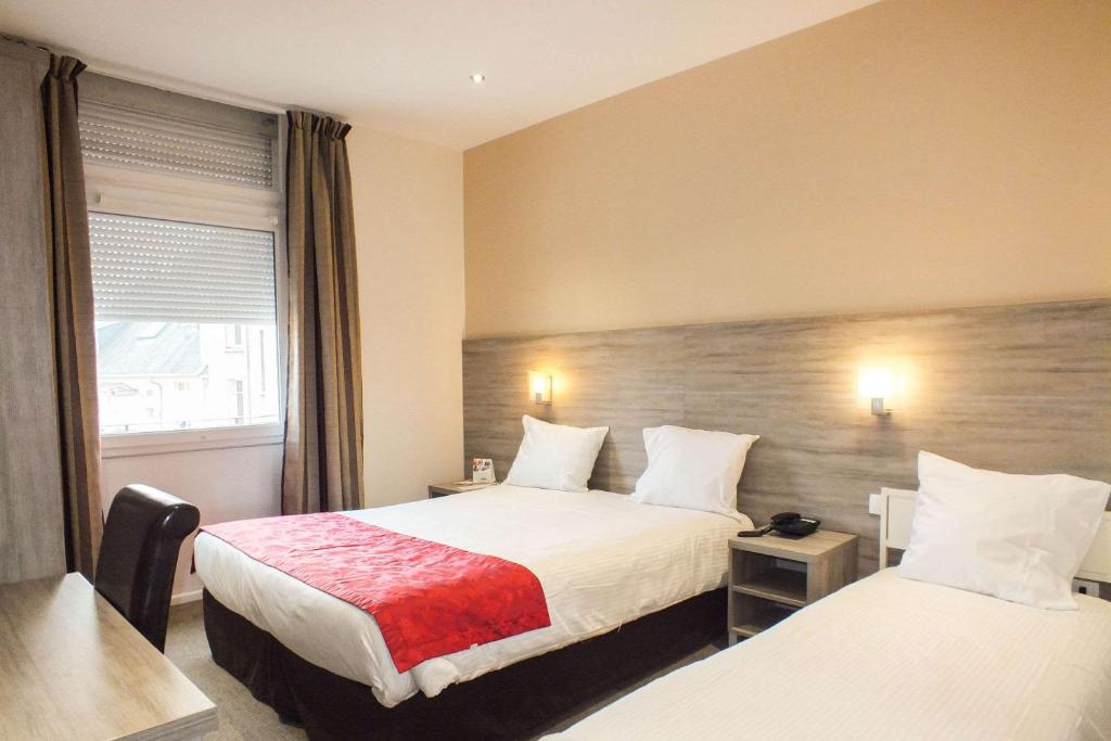 Postel nebo postele na pokoji v ubytování Hotel Cecil Metz Gare