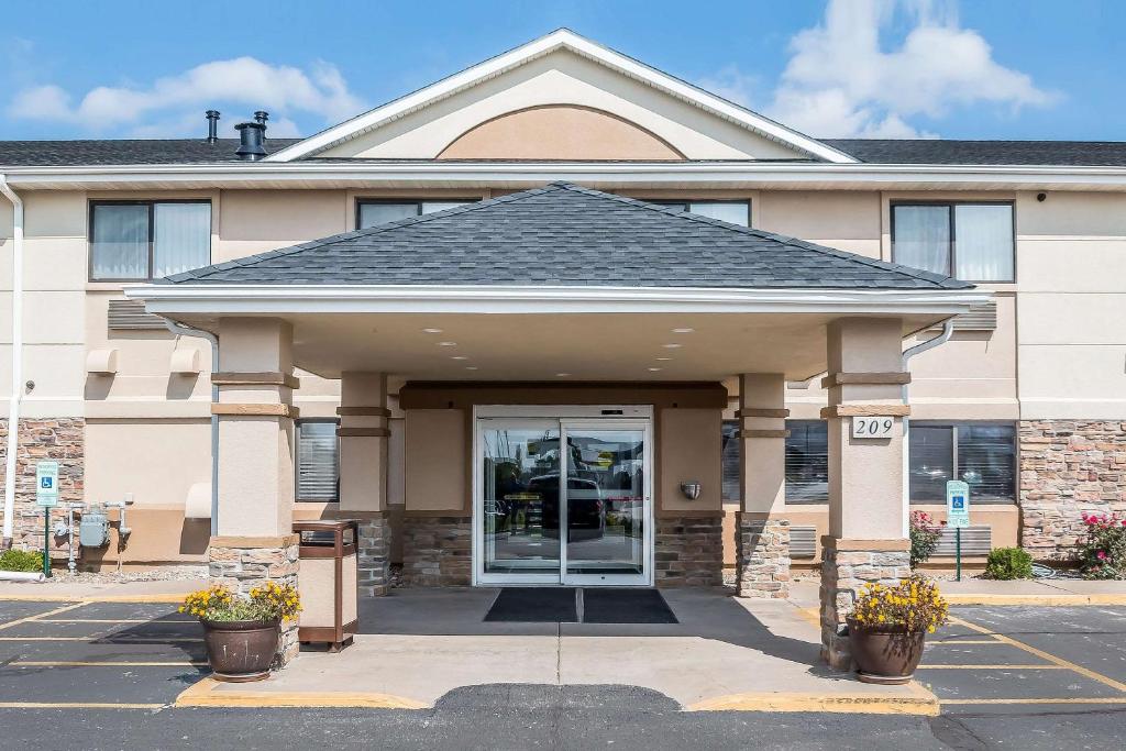 a large white building with a large window at Quality Inn - Coralville in Coralville