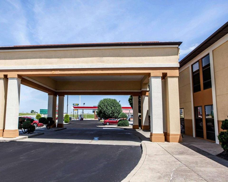 a parking lot in front of a gas station at Quality Inn Arcola in Arcola