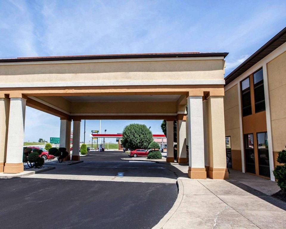 a parking lot in front of a gas station at Quality Inn in Arcola