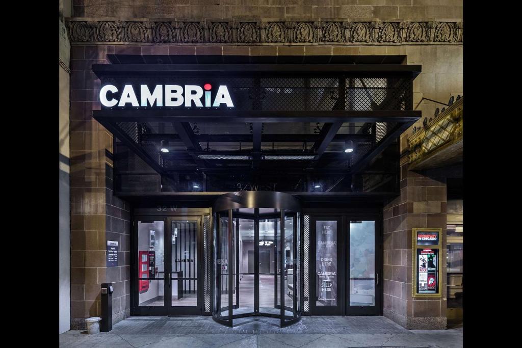 a large building with a sign on the side of it at Cambria Hotel Chicago Loop/Theatre District in Chicago