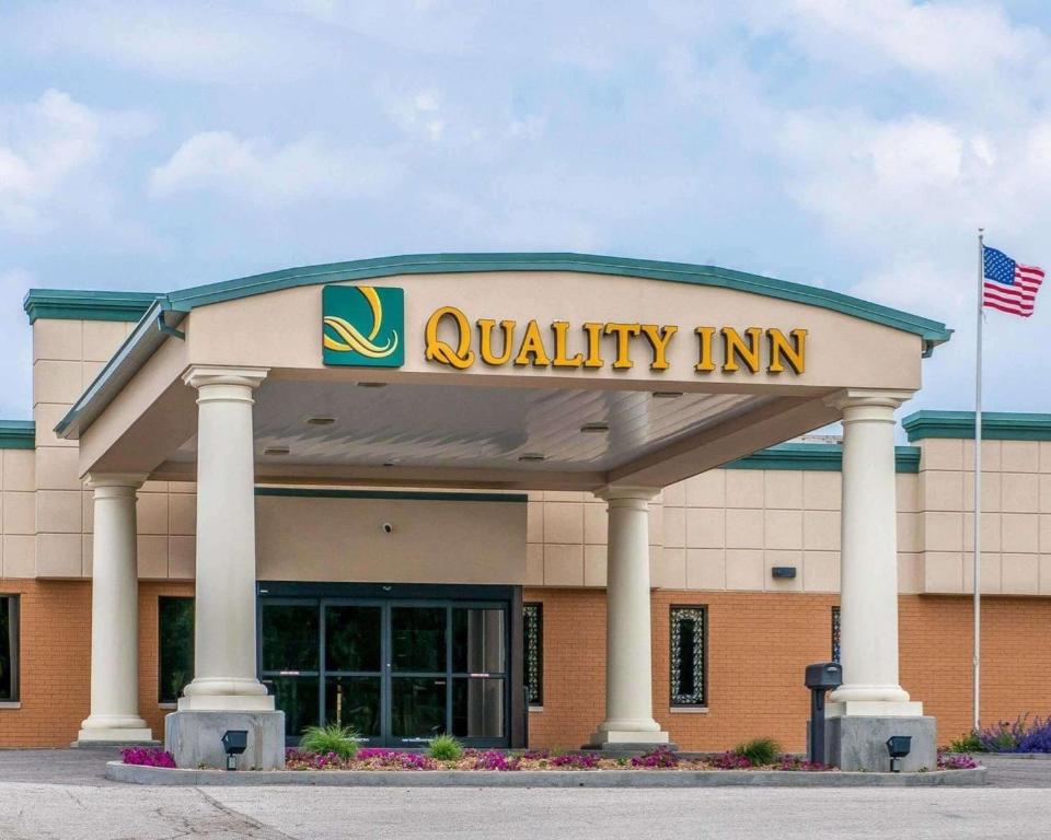 a walmart building with a sign on it at Quality Inn in Huntingburg