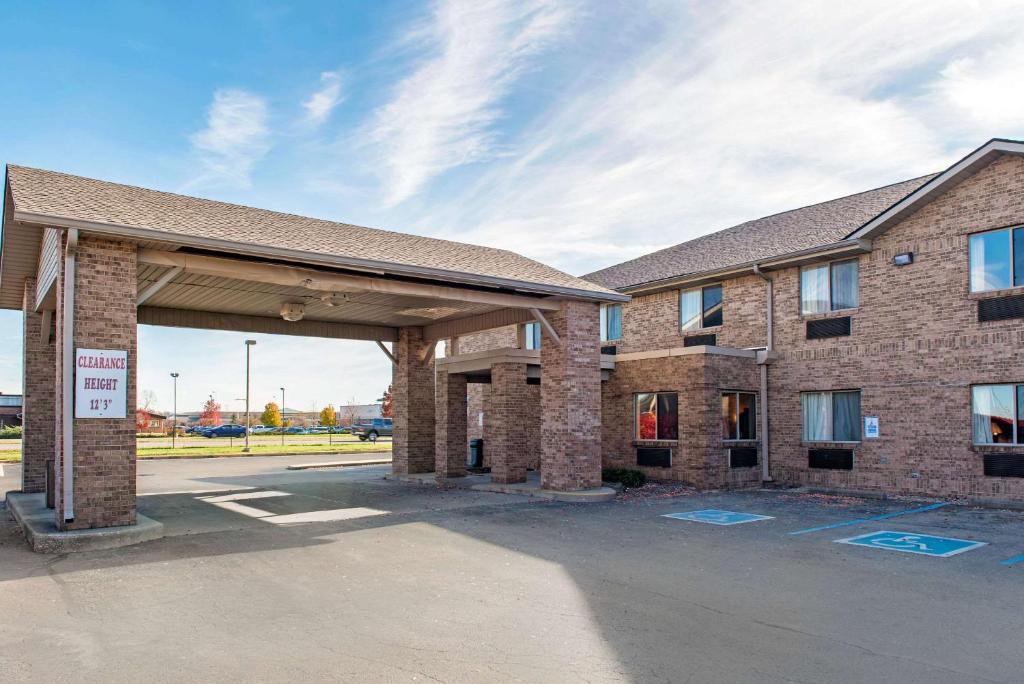 a large brick building with a parking lot at Quality Inn Noblesville-Indianapolis in Noblesville