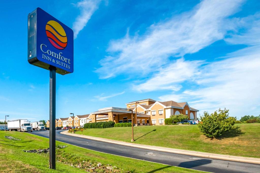 a sign for a hotel on the side of a road at Comfort Inn & Suites in North East