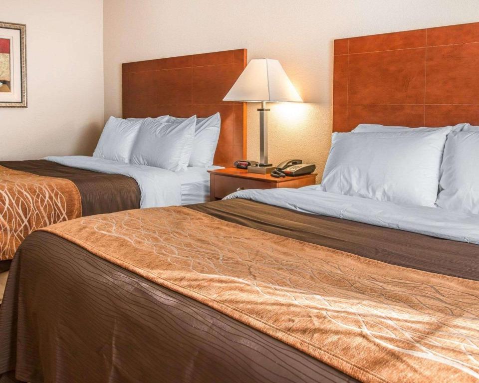a hotel room with two beds and a telephone at Quality Inn Near Interstate I94 in New Buffalo