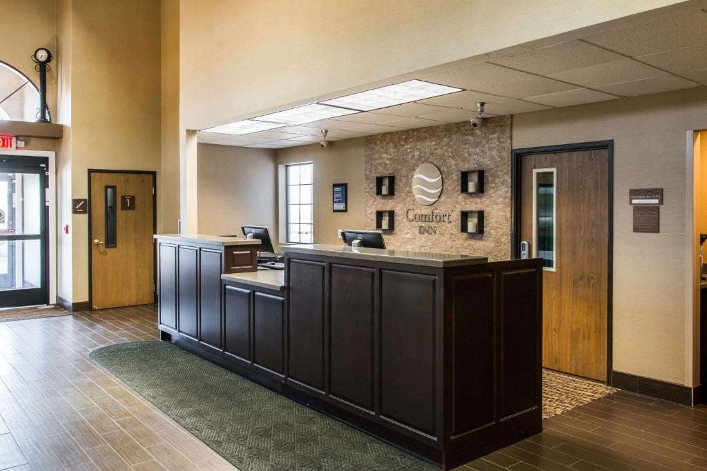 a lobby with a reception desk in a building at Comfort Inn Ludington near US-10 in Ludington