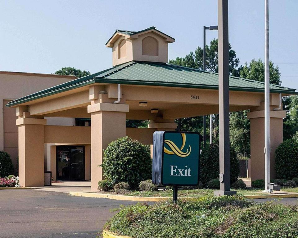 a exit sign in front of a building at Quality Inn Magee in Magee