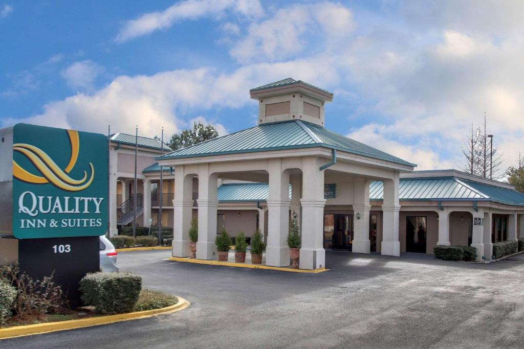 a building with a sign in front of it at Quality Inn & Suites in Clinton