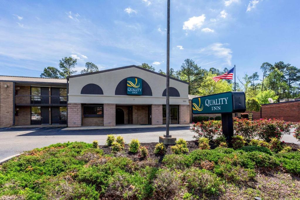 a building with a sign in front of it at Quality Inn in Tupelo