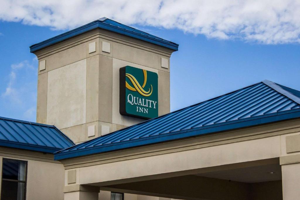 a building with a walmart sign on top of it at Quality Inn Fuquay Varina East in Fuquay-Varina