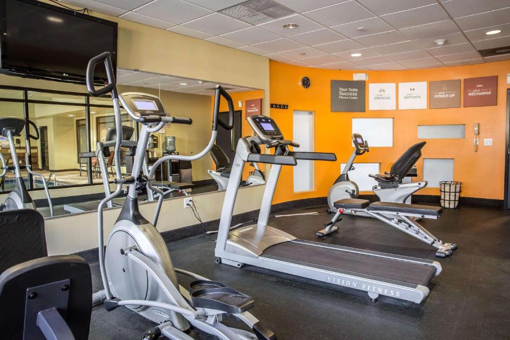 a gym with cardio machines and a flat screen tv at Comfort Suites New Bern near Cherry Point in New Bern