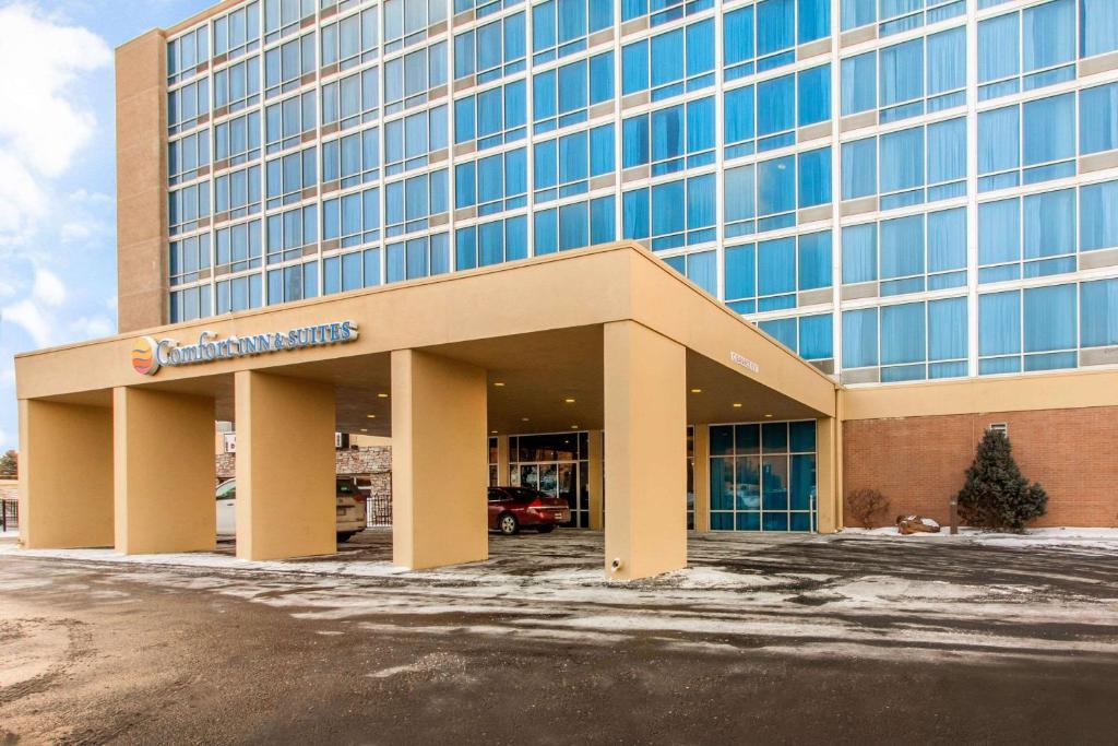 a large building with a parking lot in front of it at Comfort Inn & Suites Omaha Central in Omaha