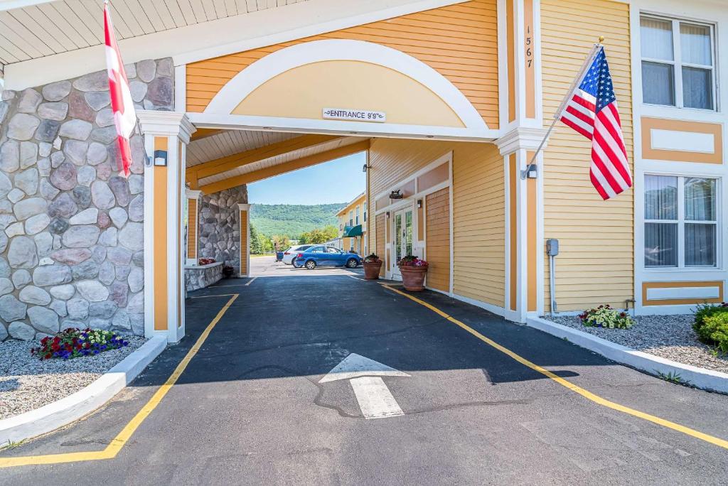 an entrance to a building with an american flag at Quality Inn North Conway in North Conway