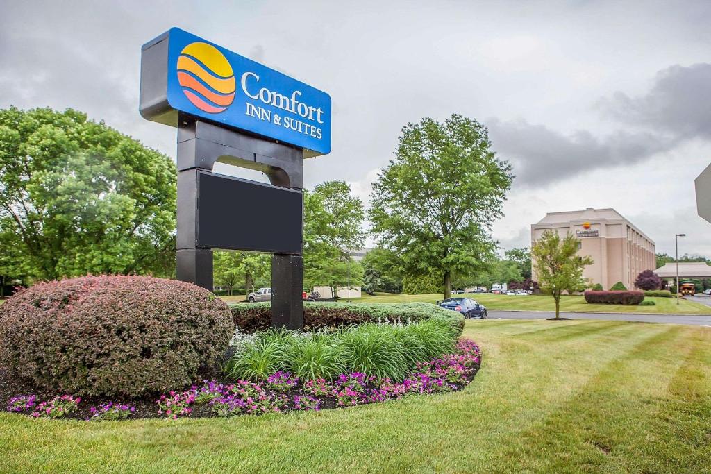 a sign for a comfort inn in a park at Comfort Inn & Suites Somerset - New Brunswick in Somerset