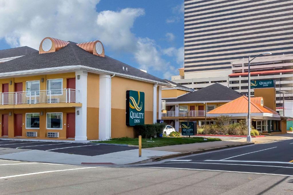 a building with a sign on the side of a street at Quality Inn Flamingo in Atlantic City