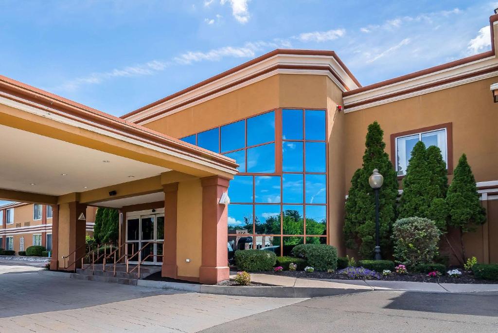 a large building with a lot of windows at Quality Inn & Suites Albany Airport in Latham